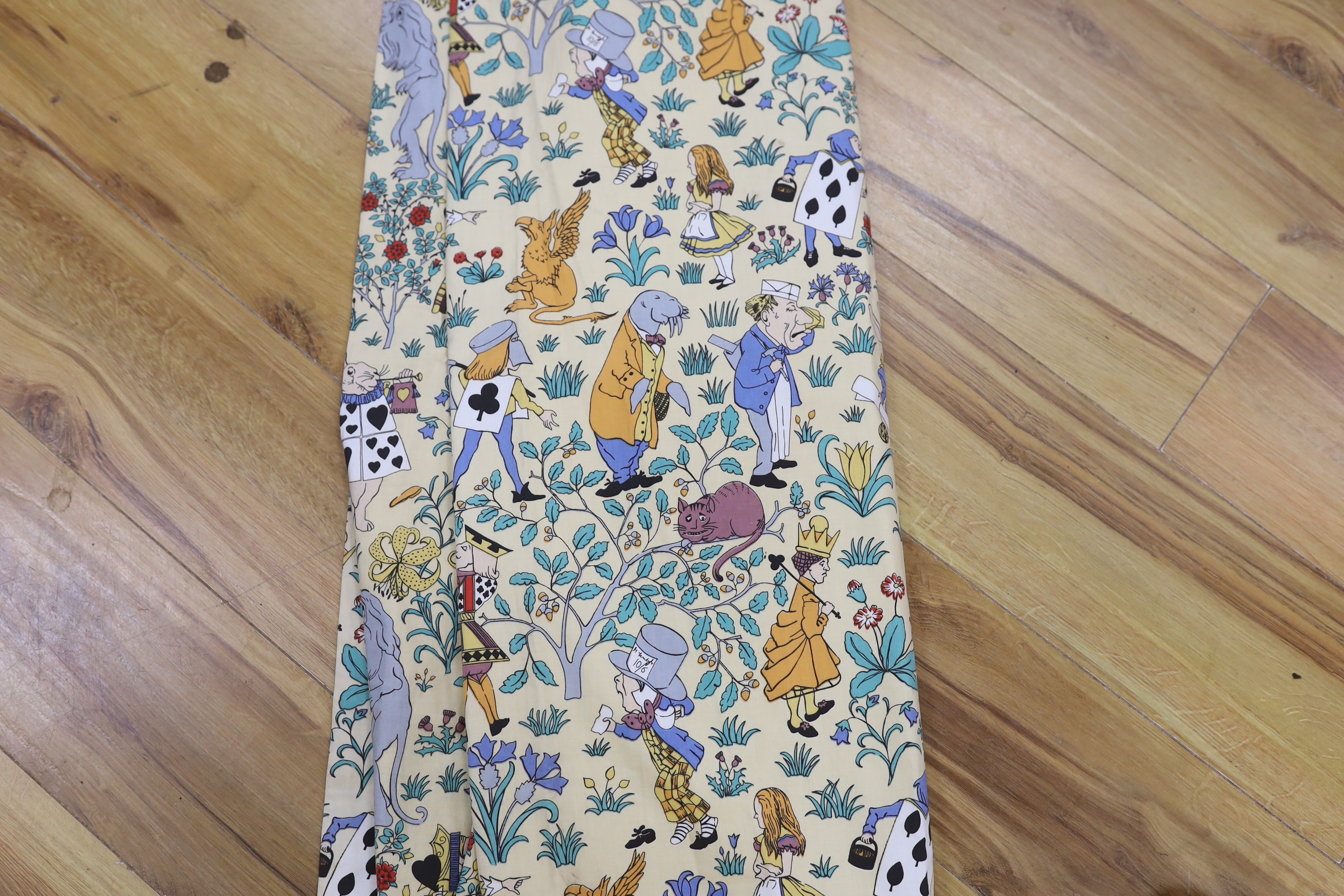 A late 1980’s vintage curtain of Alice in Wonderland, design originally by C. F. A. Voysey; selvage printed; The Habitat V&A collection, 130cm wide at the bottom, 130cm long